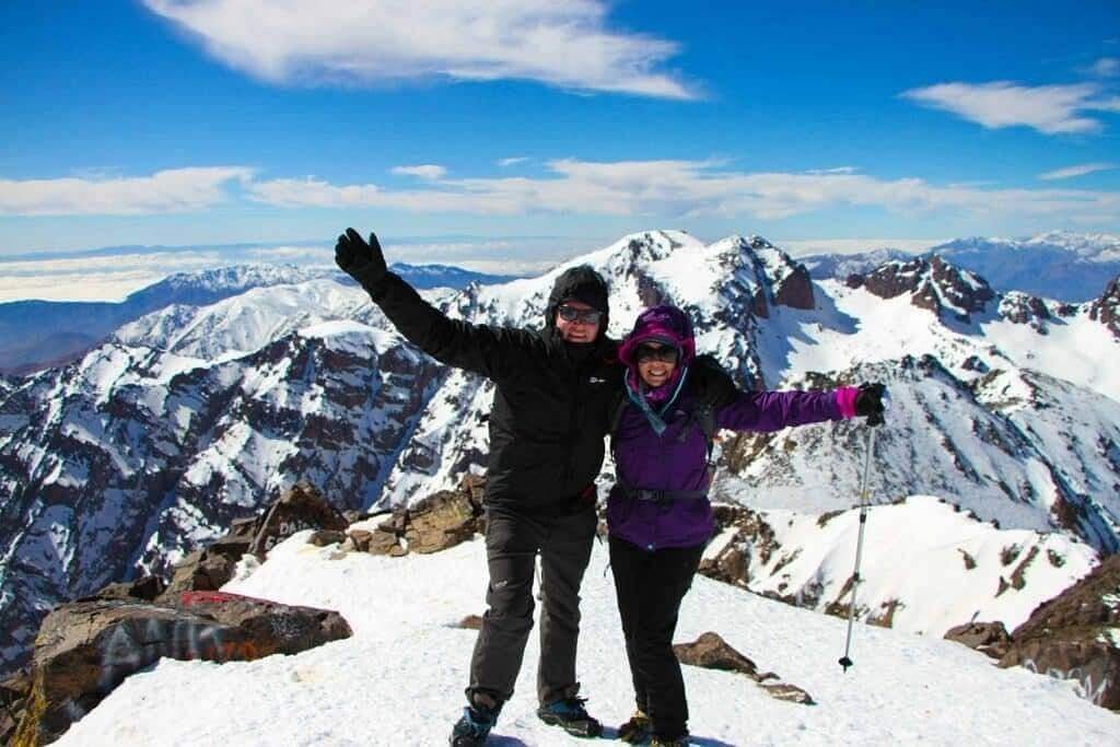 Two Triumphant climbers at the summit of Mount Toubkal